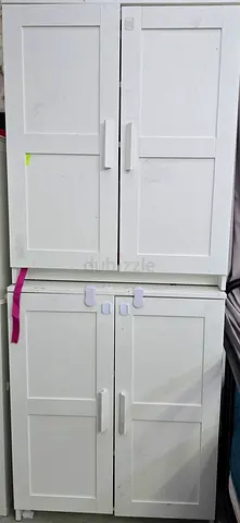 White double-door storage cabinets (set of 2) — good condition