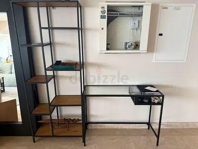 Black metal shelving unit and desk