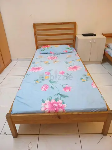IKEA single wooden bed frame with mattress - good condition, 100 AED