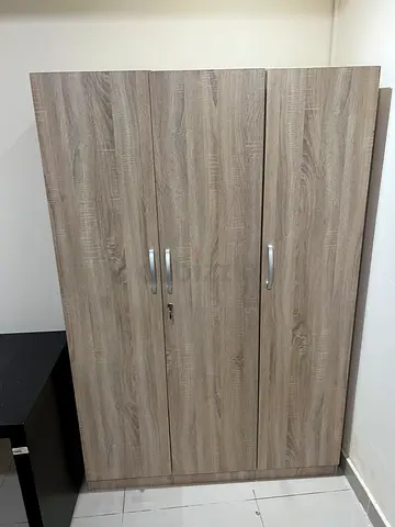 Three-door wooden wardrobe in good condition (light oak finish) 2 pieces