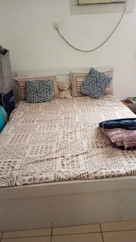 Double bed frame with mattress and bedding - simple white storage bed