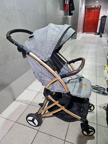 Lightweight grey stroller with reclining seat and canopy.Sparely used. Super compact, folds small