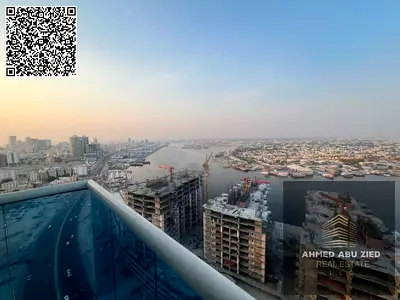 شقة غرفتين وصالة في برج الواحة بإطلالة على الخور مع بلكون وموقف سيارة وجيم ومسبح، تشطيب نظيف وإيجار سنوي 50 ألف درهم، موقع مميز وقريب من الخدمات