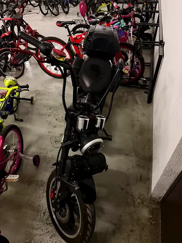 Black electric scooter with top box and side bags - good condition