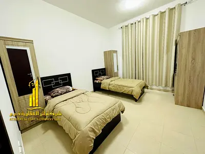 Luxurious two-bedroom apartment with a living room, fully furnished with brand new, high-end furniture, and includes private parking.