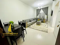 Luxury apartment, second occupancy. Two bedrooms, living room, and open balcony. Ajman Corniche. Ful