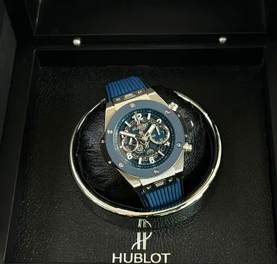 This Hublot Big Bang Unico Titanium Blue Ceramic features a striking skeleton dial and a textured bl