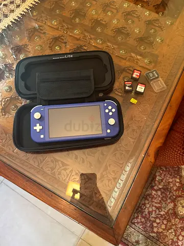 Nintendo switch lite + 3 games + bag + sd card