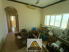 1BR in Al Bustan, Ajman, split AC, prime location near services, AED 25K yearly, 4 payments.