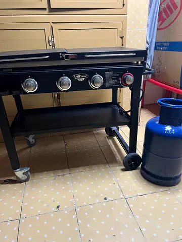 Used 4-Burner Outdoor Gas Grill on Wheels - Good Condition
