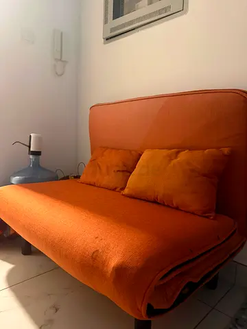 Orange compact sofa bed - good for small spaces