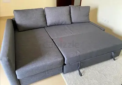 Grey fabric L-shape sofa bed with storage