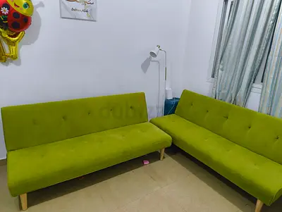 Pair of Green Armless Sofa Beds / Futons - Good Condition
