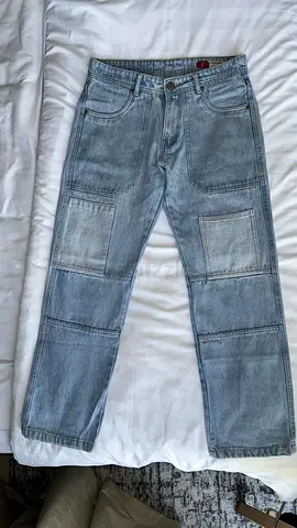 Straight-leg or relaxed-fit light-wash denim