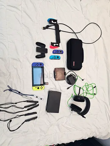 Nintendo Switch console with multiple controllers, dock and accessories - good condition
