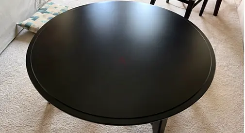 MOVE OUT SALE — Round black wooden dining/coffee table - good condition (IKEA Kragsta)