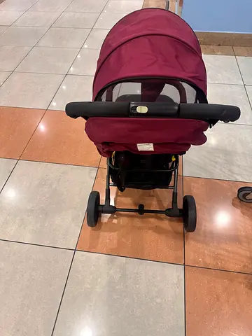 Lightweight maroon baby stroller / pram in good condition