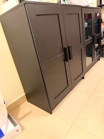IKEA Black Storage (wood and glass door) Cabinets.