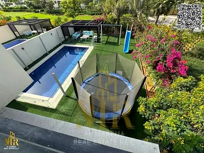 Corner villa in Al Zorah with partial lake and golf course views | Two floors | 4 master bedrooms | Private garden, swimming pool, and children's play