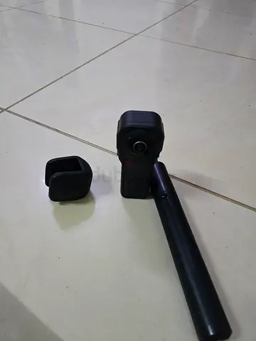 Compact action camera with short selfie stick and lens hood — used insta 360 1 inch edition