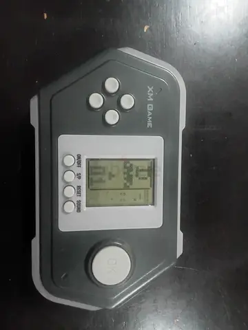Portable handheld LCD game - XM Game (battery powered) best offer 35aed