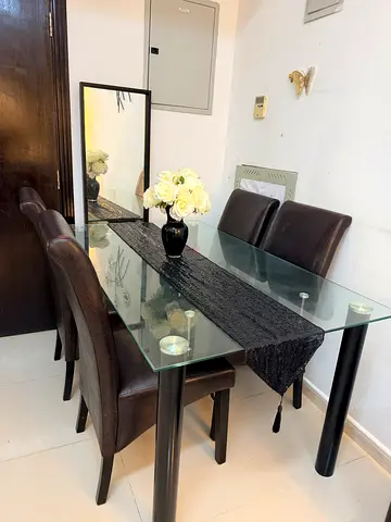 **Dining Table \+ 4 Leather Chairs – AED 100**