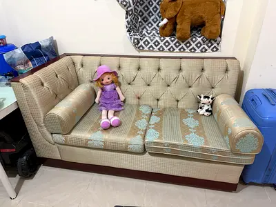 Two-seater upholstered sofas (2pcs)in beige with patterned cushions