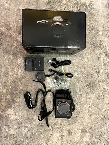 Sony Alpha mirrorless camera body with charger, cables and box
