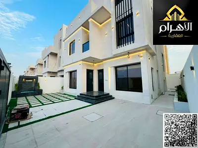 Luxury villa for sale in Al Bahia area – Ajman, two floors and a roof, at a special price including registration and ownership fees for all nationalit