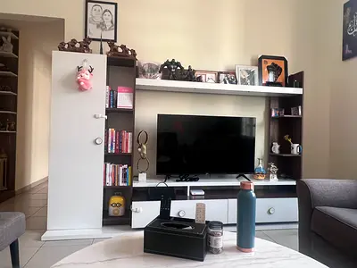 Modern TV Entertainment Unit with Shelves and Drawers - White & Dark Wood.