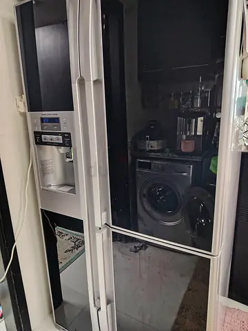 Black/Silver side-by-side refrigerator with water dispenser - good condition