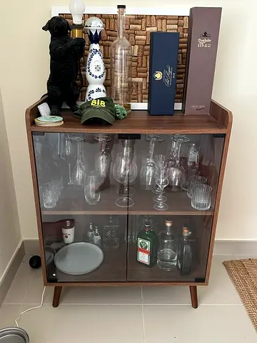 Compact wooden display cabinet with glass doors — small drinks/serveware cabinet