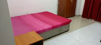 Master bedroom with balcony with fully furnished for family near Dubai border.