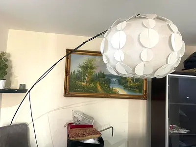 Large modern arc floor lamp with round white paper shade