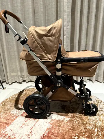 Convertible dual-seat beige stroller - good condition