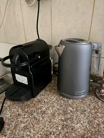Grey electric kettle in good working condition and a coffee espresso machine
