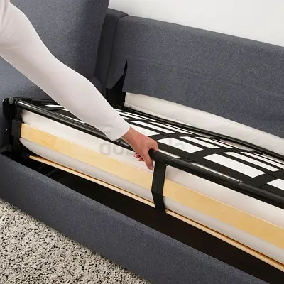 Grey fabric sofa bed with under-seat storage, fold-out mechanism