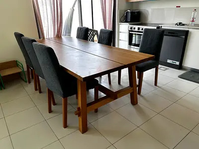 Solid wood dining table with 6 upholstered chairs - excellent condition