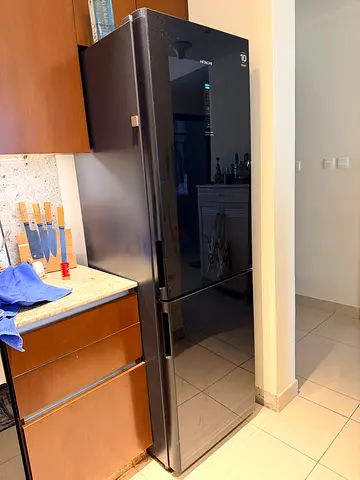 Almost-new black double-door refrigerator, good condition