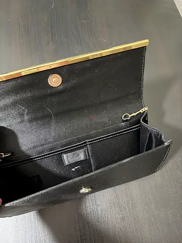Black clutch bag with gold trim - good condition