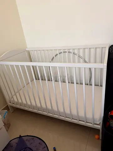 White wooden baby crib / cot - good condition
