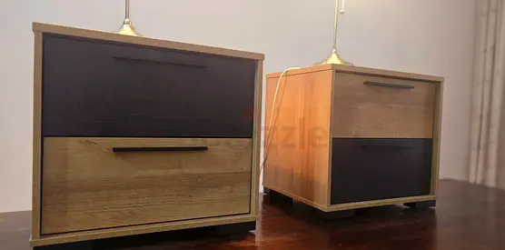 Pair of wooden bedside cabinets with two drawers — good condition