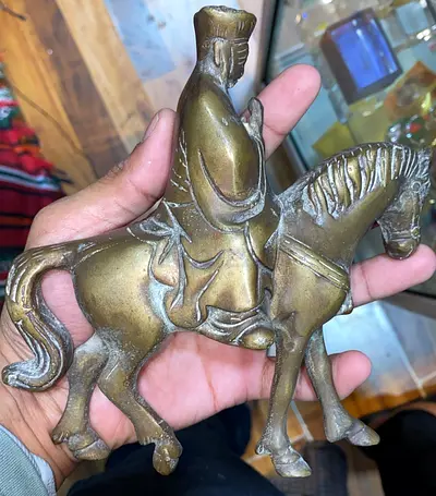 Antique brass horse rider