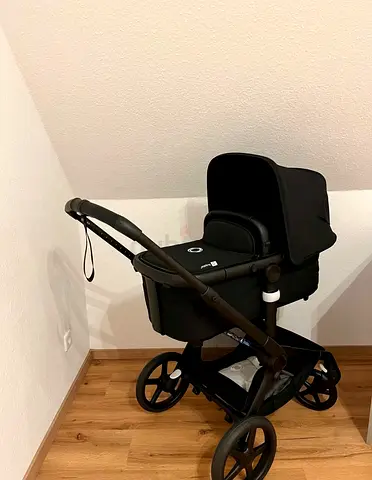 Bugaboo Fox 5 black black like new Under warranty till 2028