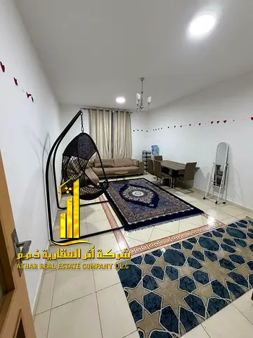 Luxury apartment, second occupancy. Two bedrooms, living room, and open balcony. Ajman, Al Rashidiya 3. Fully furnished for monthly rent.