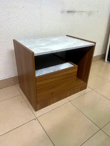 Compact wooden bedside table with marble-effect top and drawer