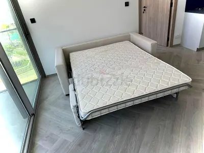 Looks great condition Italian comodo three seater sofa bed