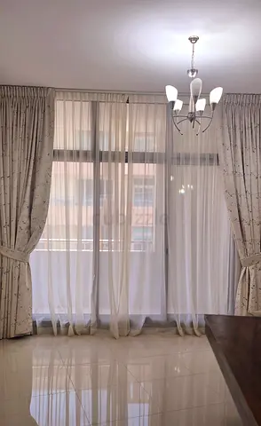 Full-length cream curtains with sheer voile panels - set