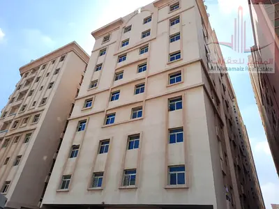 A room and a living room with a balcony near Al-Hikma School for 24,000 annually.