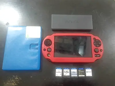 Sony PS Vita Slim Red cover with 5 Game Cards and Case